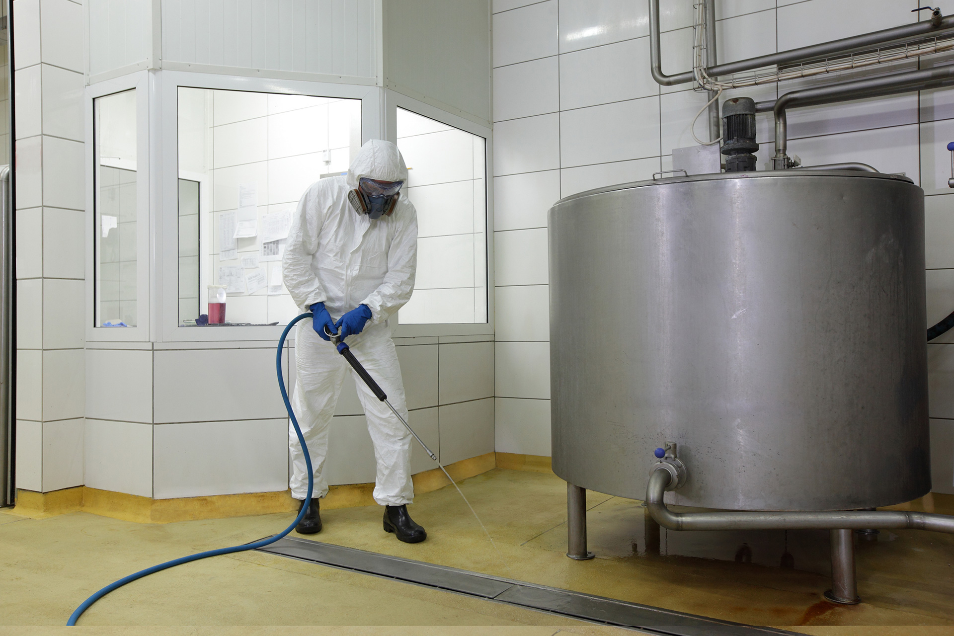 Man Cleaning Container